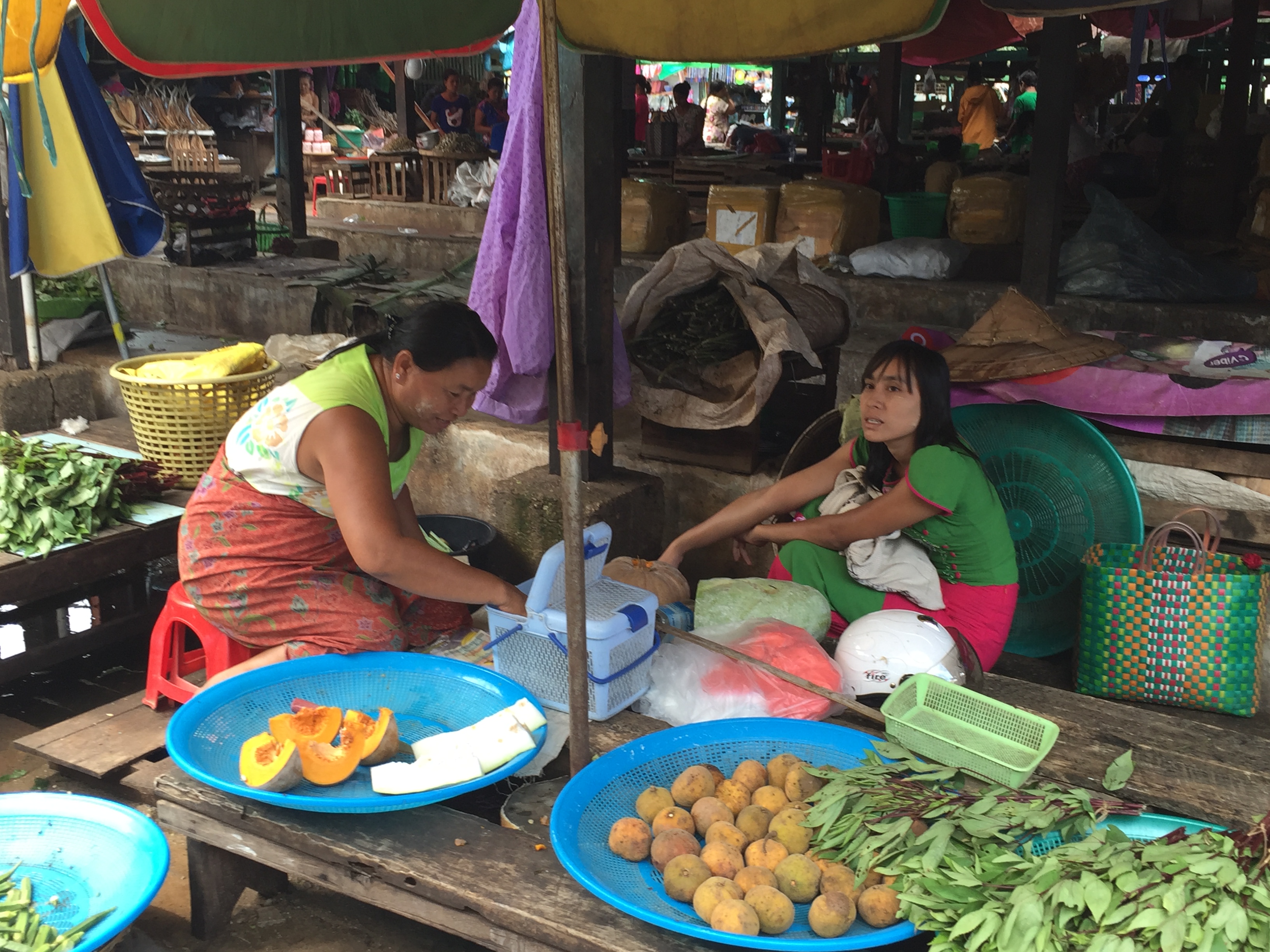 Women vendors at a local market in Myanmar